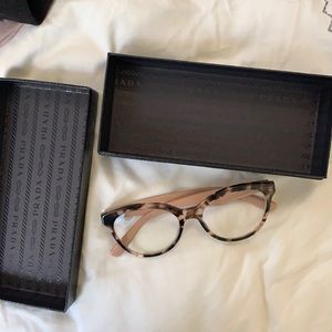 Blogger tortoise shell Prada glasses pink & brown